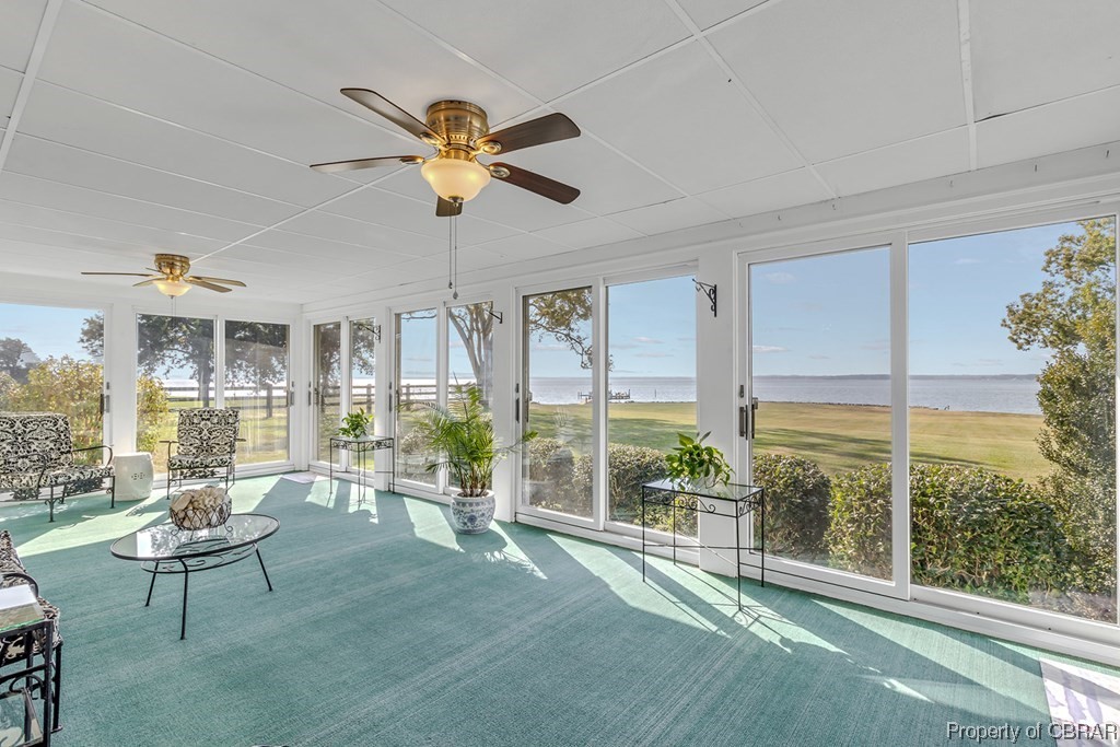 1057 Monaskon Road Lancaster, VA 22503 - Photo 10 of 43 Sunroom / solarium with ceiling fan and a water view