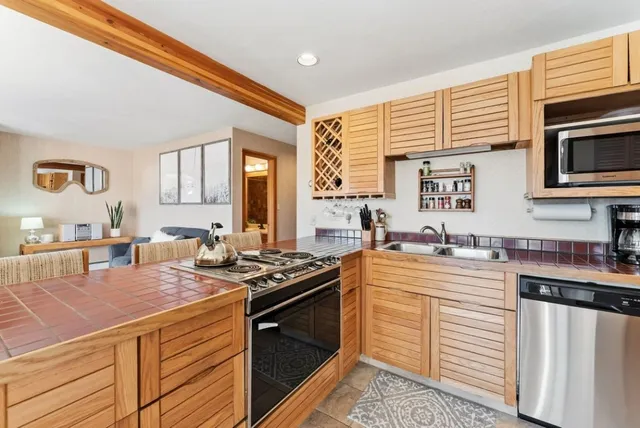 a kitchen with a stove and a sink