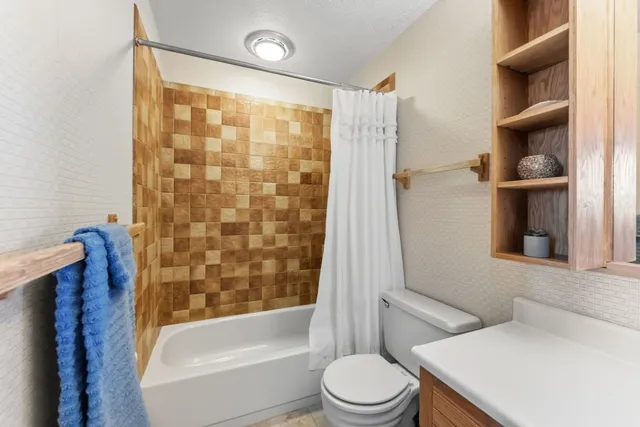 a bedroom with furniture and a window