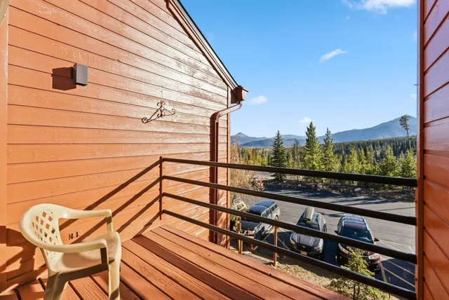 a room with pool table and windows