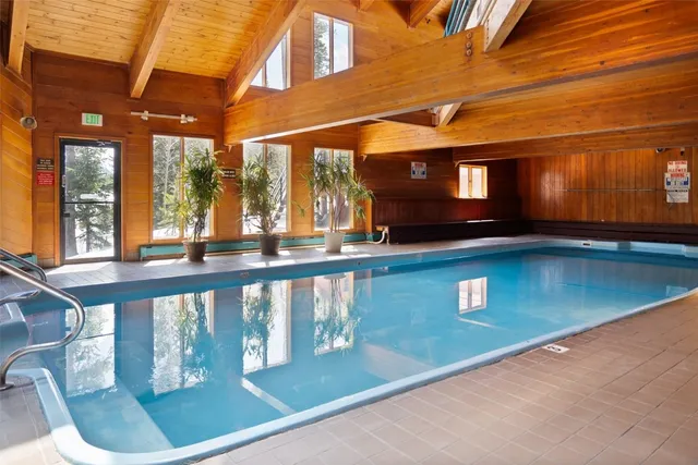 a view of a brick building with a bench in a patio