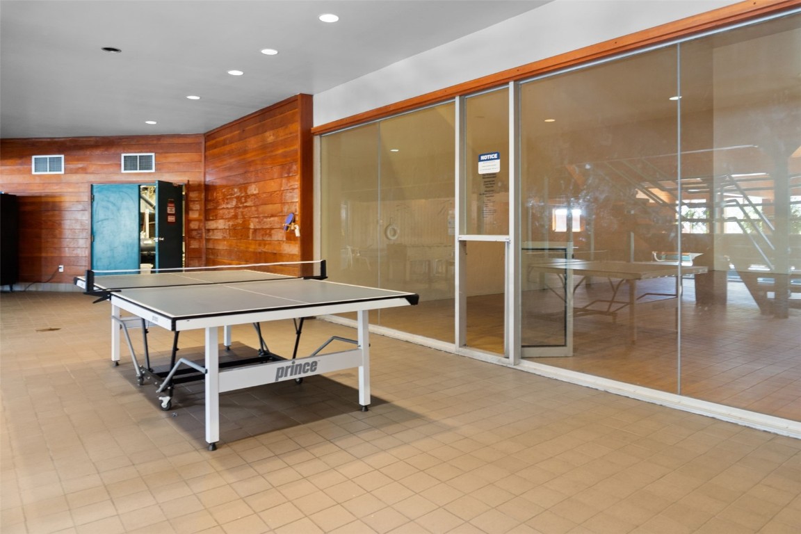 91300 Ryan Gulch Road, Unit 91311 Silverthorne, CO 80498 - Photo 23 of 28 a room with pool table and windows