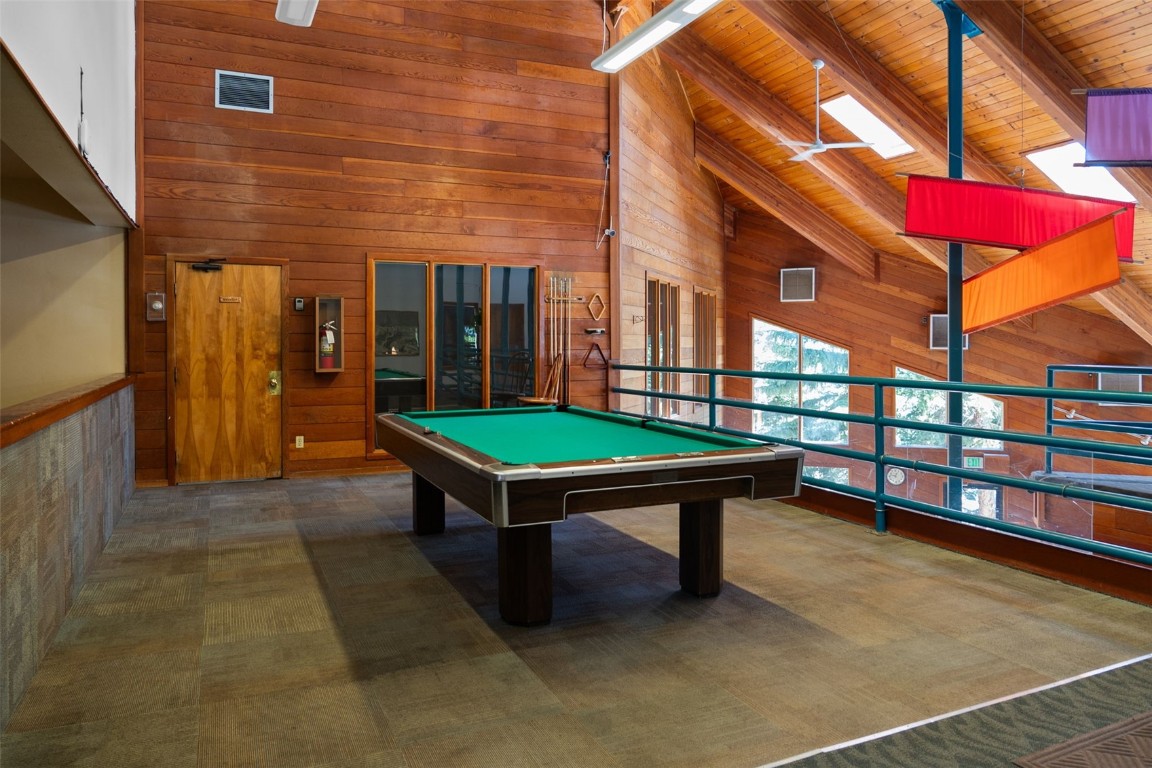 91300 Ryan Gulch Road, Unit 91311 Silverthorne, CO 80498 - Photo 24 of 28 a view of a brick building with a bench in a patio