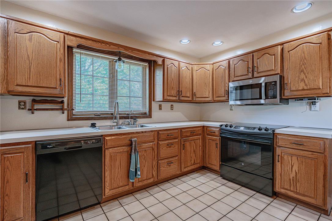 652 Old State Road Oley, PA 19547 - Photo 16 of 54 Well-lit kitchen with classic oak cabinetry and ample counter space.