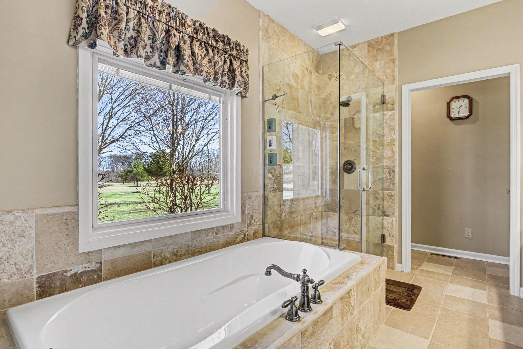 1855 Spring Valley Road London, OH 43140 - Photo 21 of 54 A garden tub for relaxing.