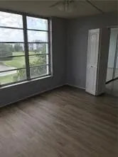 a kitchen with granite countertop a stove and a microwave