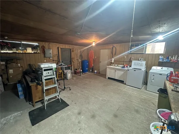 a storage room with washer and dryer