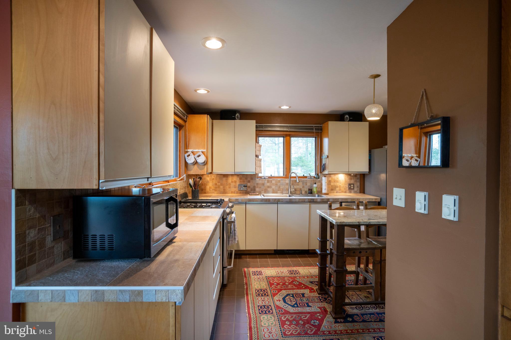 854 Thomas Street State College, PA 16803 - Photo 14 of 82 a kitchen with a sink appliances and cabinets