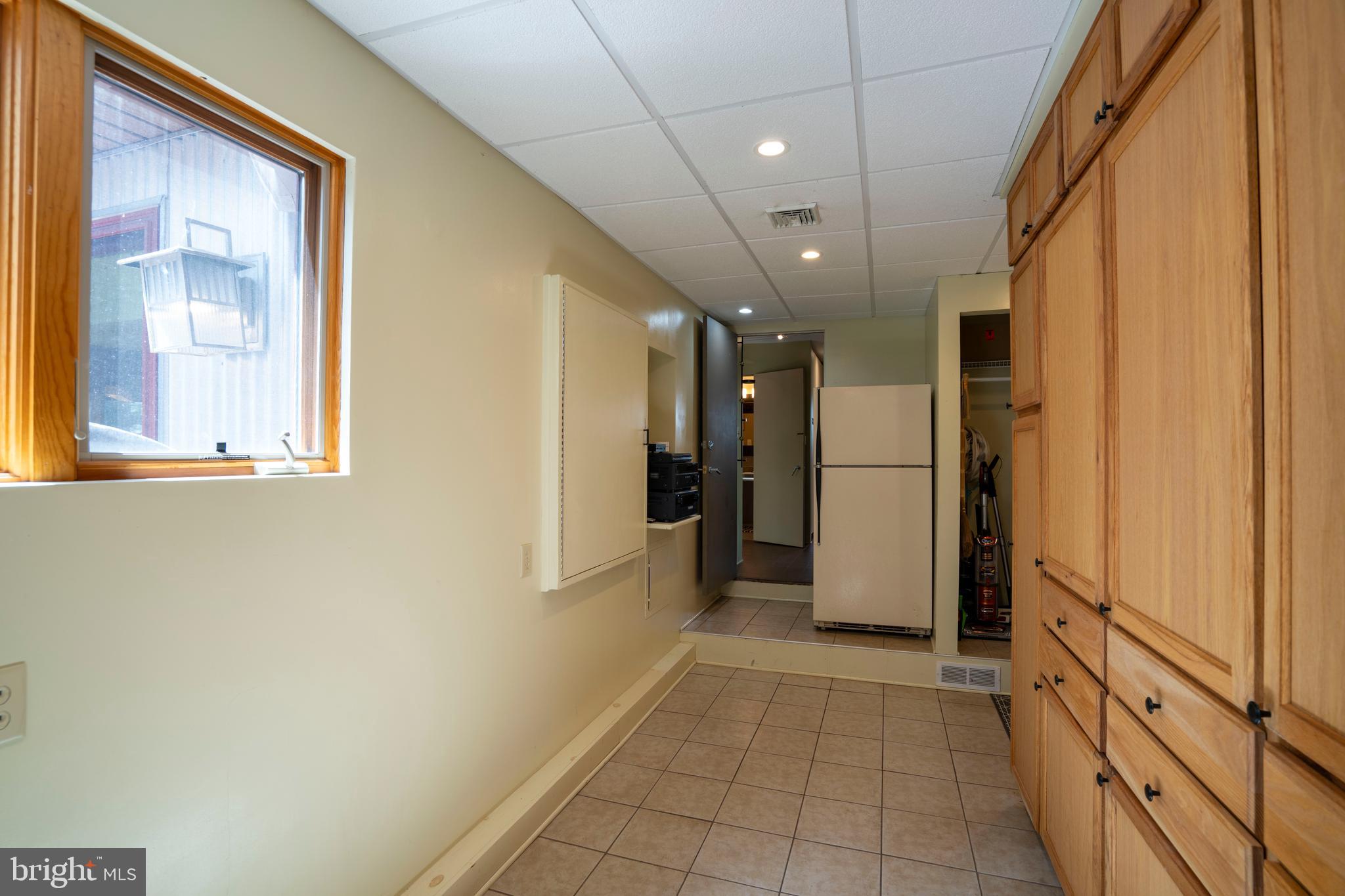 854 Thomas Street State College, PA 16803 - Photo 31 of 82 a view of a hallway with wooden shelves