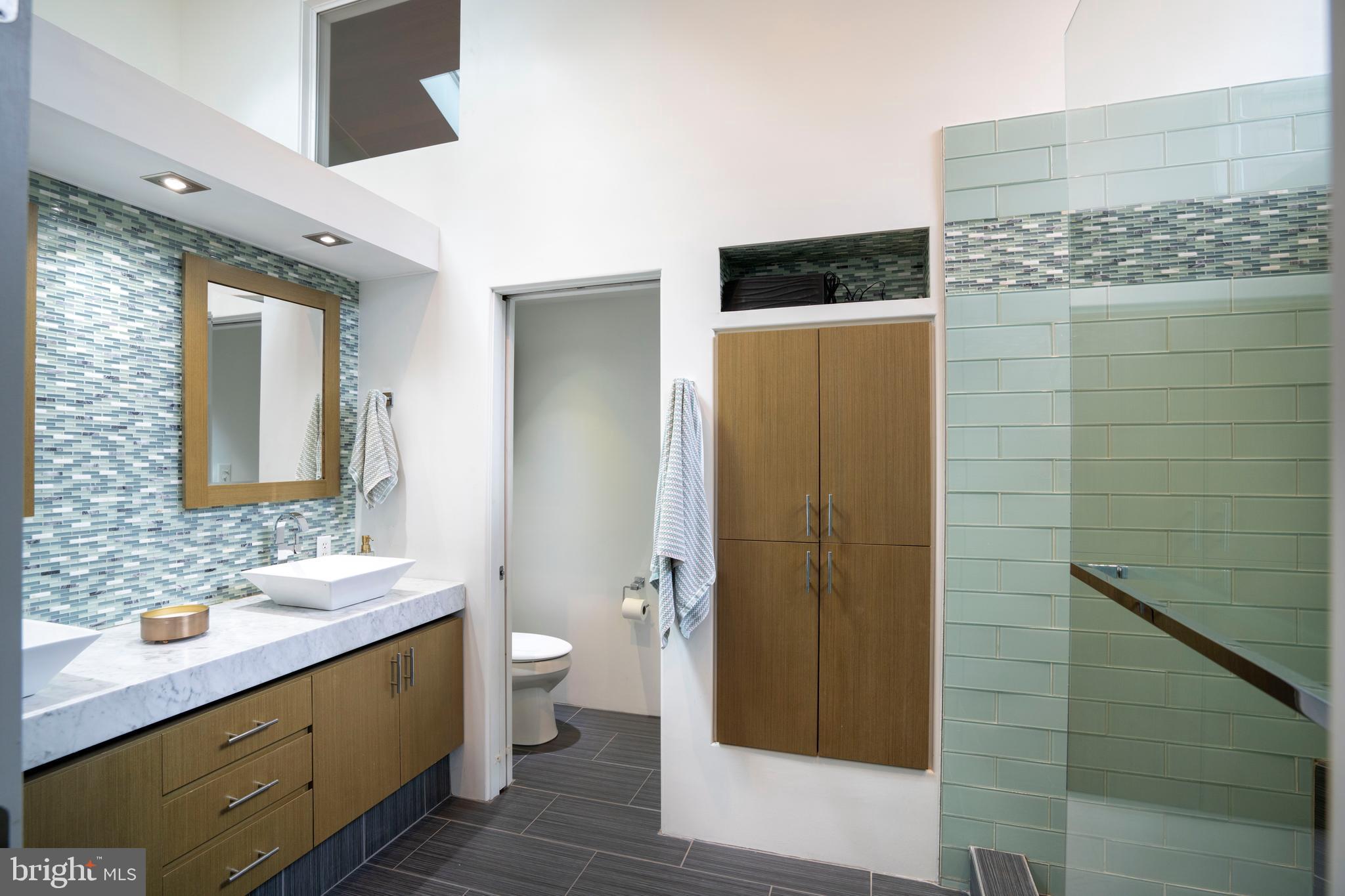 854 Thomas Street State College, PA 16803 - Photo 43 of 82 a bathroom with a double vanity sink toilet and shower