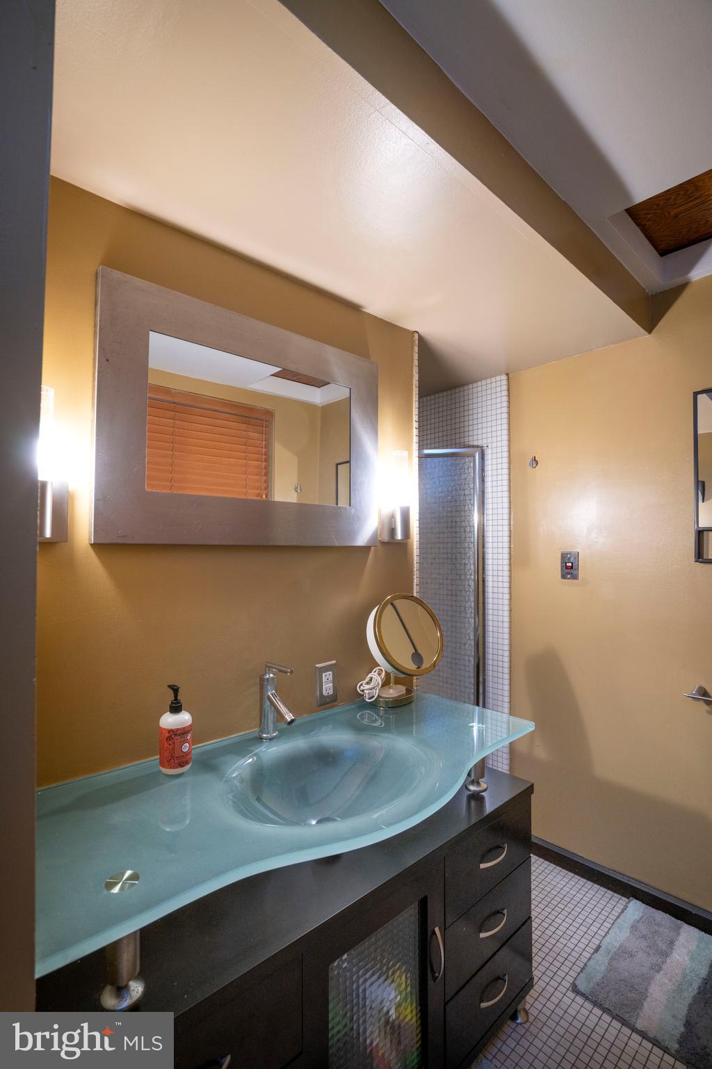854 Thomas Street State College, PA 16803 - Photo 51 of 82 a bathroom with a granite countertop sink and a mirror