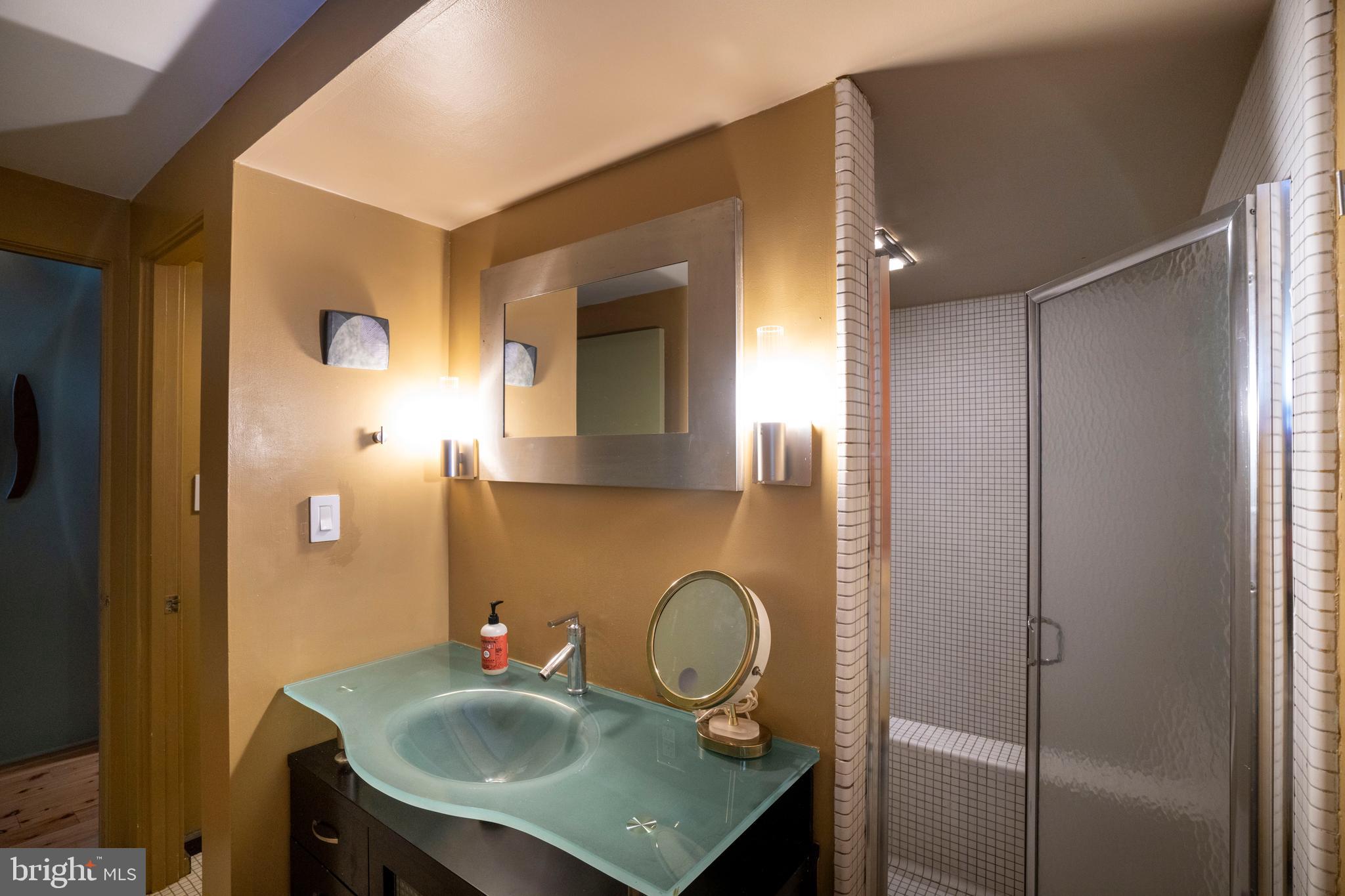 854 Thomas Street State College, PA 16803 - Photo 52 of 82 a bathroom with a sink a mirror and vanity