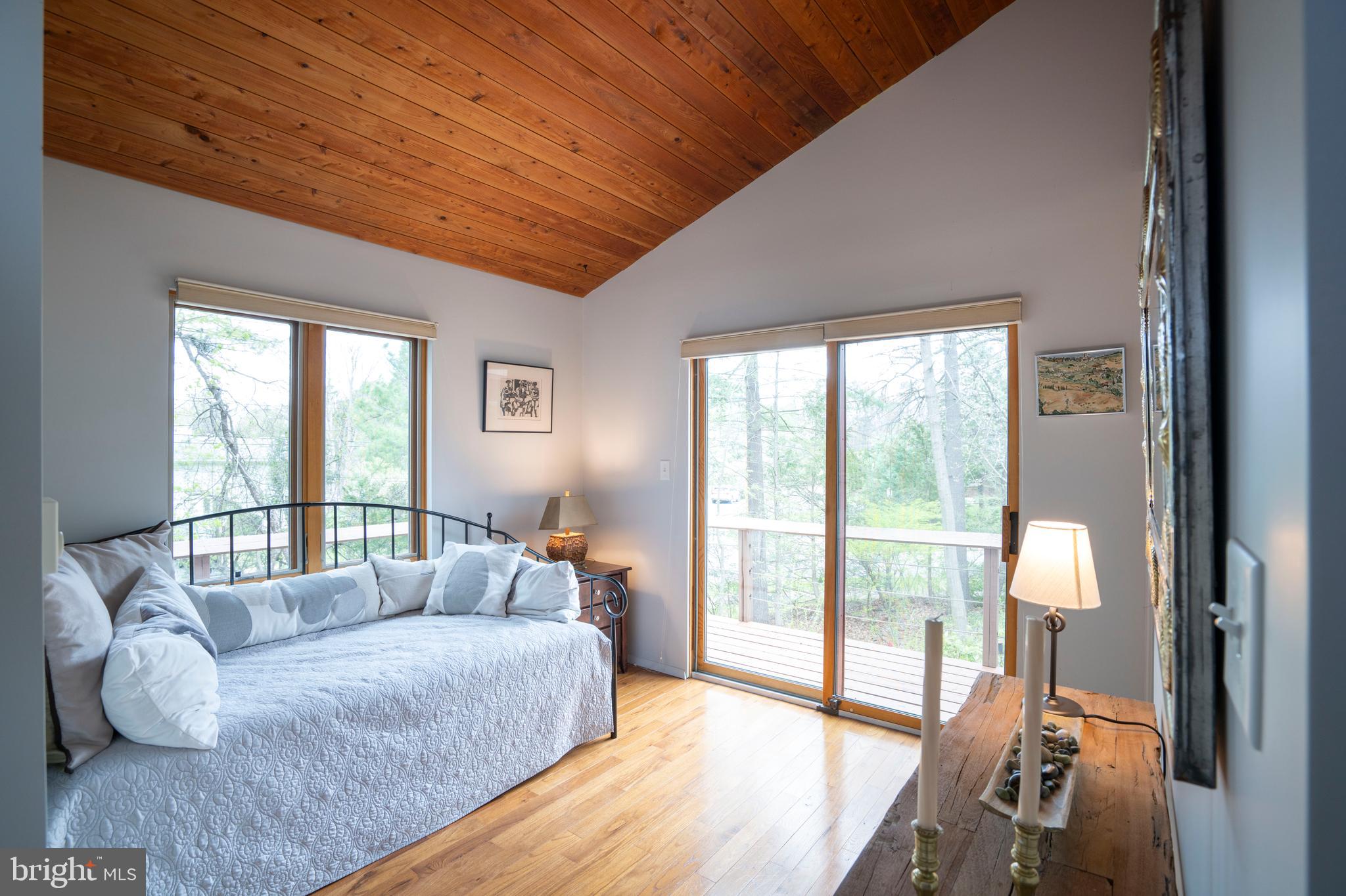 854 Thomas Street State College, PA 16803 - Photo 57 of 82 a bedroom with furniture and large windows