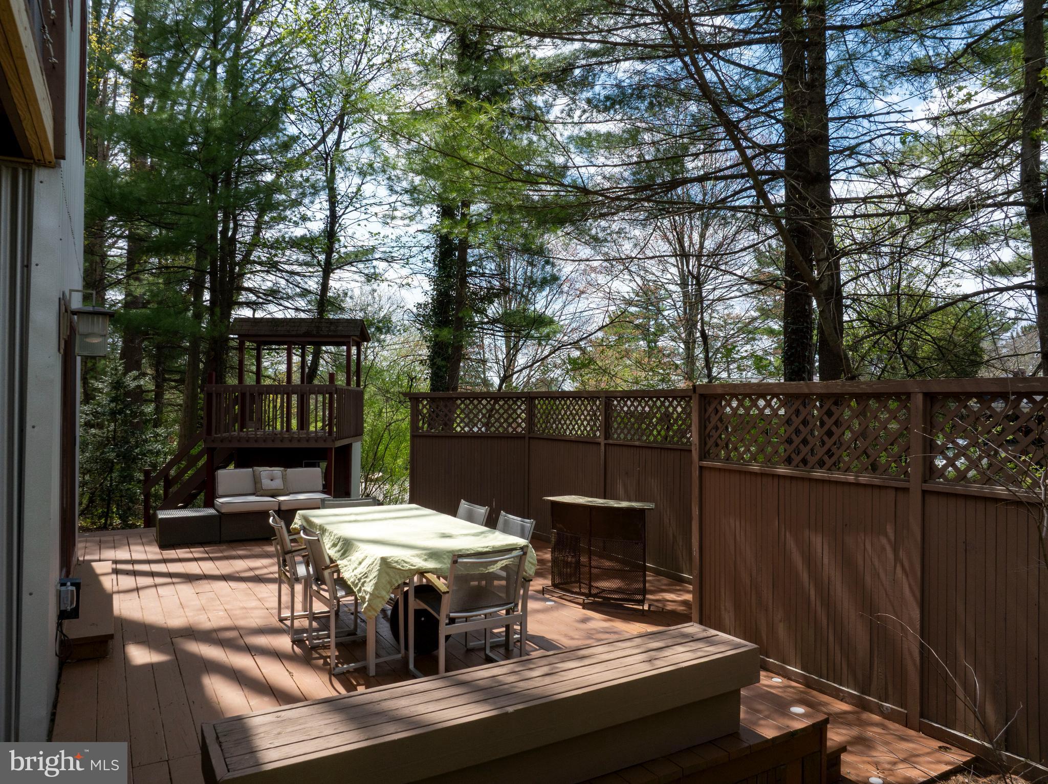 854 Thomas Street State College, PA 16803 - Photo 62 of 82 a view of a patio with table and chairs with wooden floor and fence