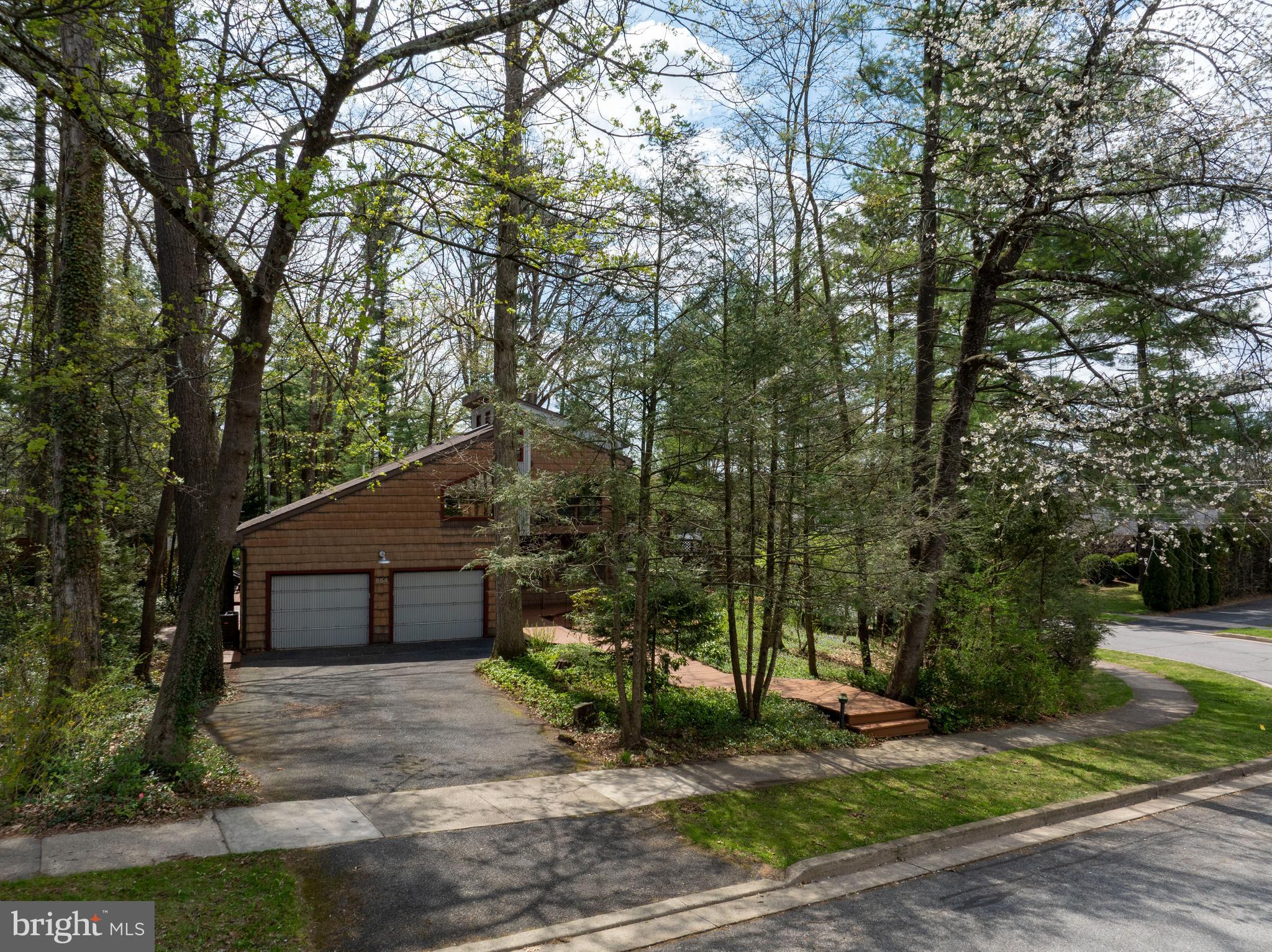 854 Thomas Street State College, PA 16803 - Photo 73 of 82 a front view of a house with a yard and garage