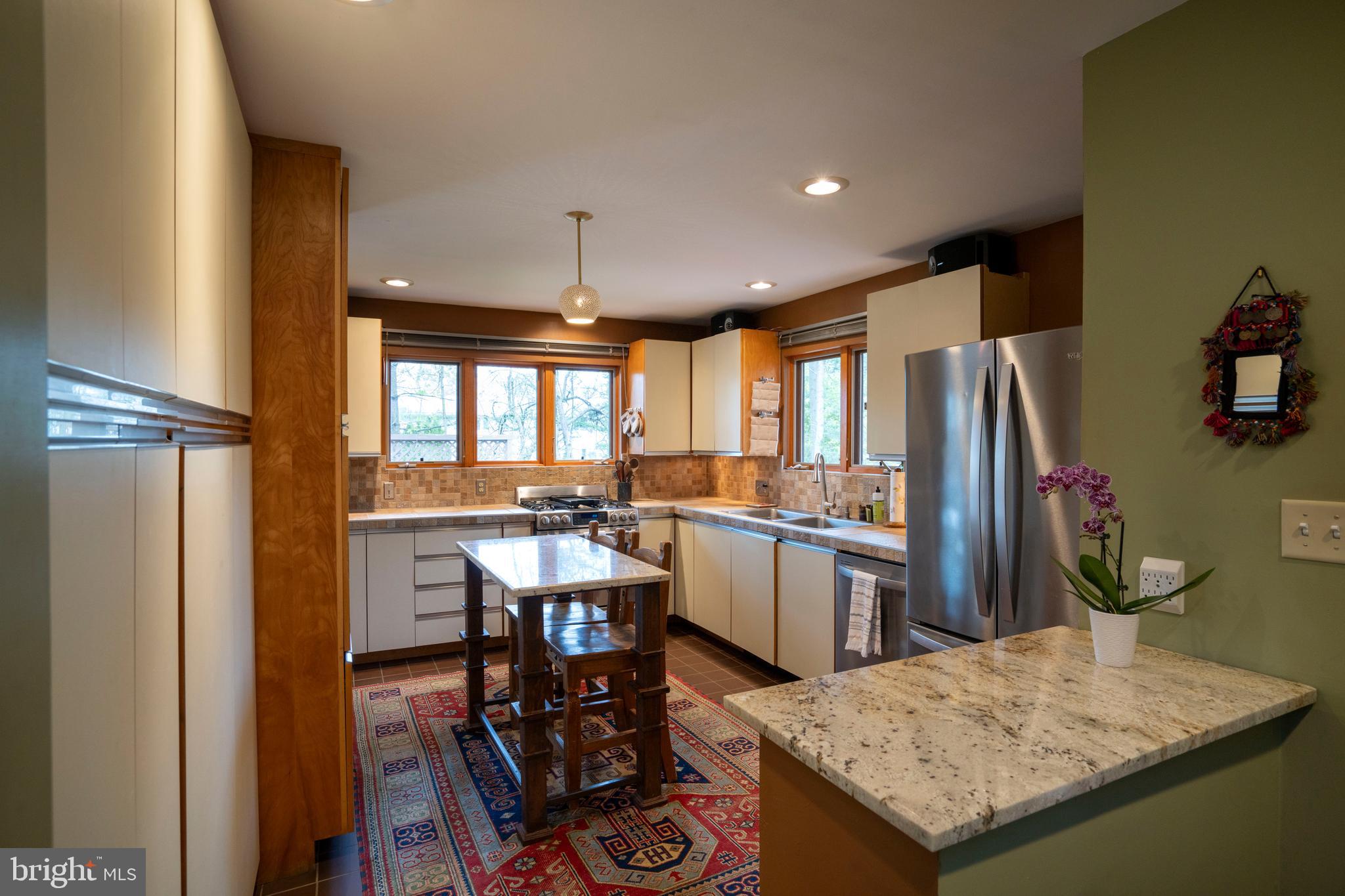 854 Thomas Street State College, PA 16803 - Photo 10 of 82 a kitchen with refrigerator and chairs