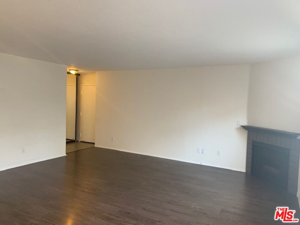 4353 Coldwater Canyon Avenue, Unit 305 Studio City, CA 91604 - Photo 13 of 27 a view of an empty room and wooden floor