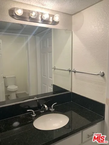a bathroom with a shower and a toilet