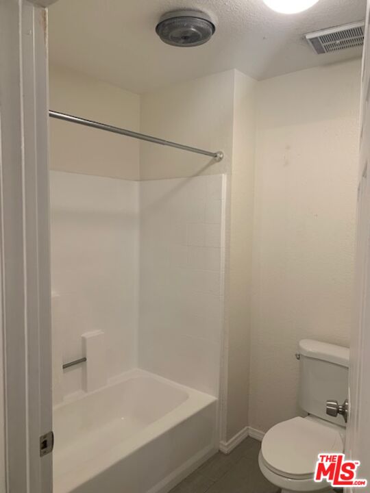 4353 Coldwater Canyon Avenue, Unit 305 Studio City, CA 91604 - Photo 16 of 27 a bathroom with a shower and a toilet