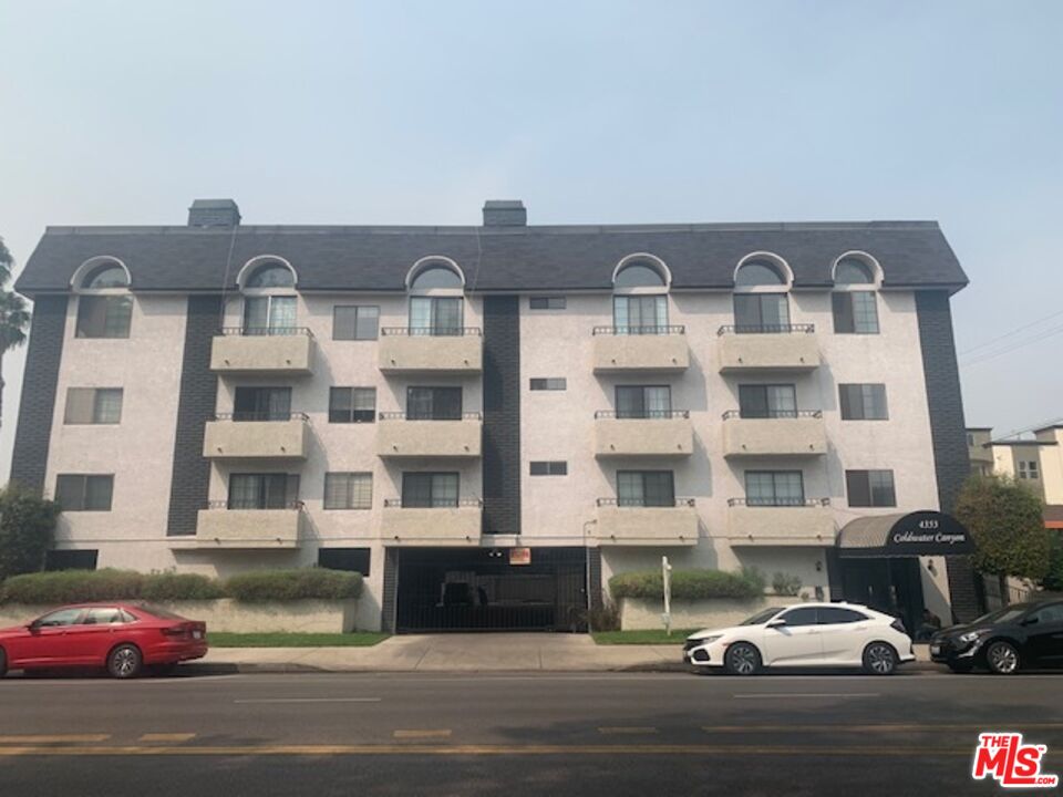 4353 Coldwater Canyon Avenue, Unit 305 Studio City, CA 91604 - Photo 2 of 27 a couple of cars parked in front of a building