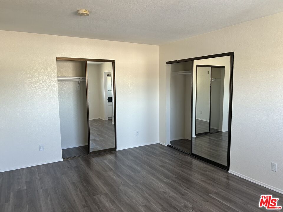 4353 Coldwater Canyon Avenue, Unit 305 Studio City, CA 91604 - Photo 25 of 27 an empty room with wooden floor and closet