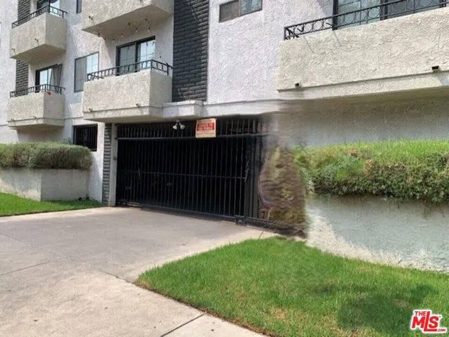 a backyard of a house with lots of green space and plants