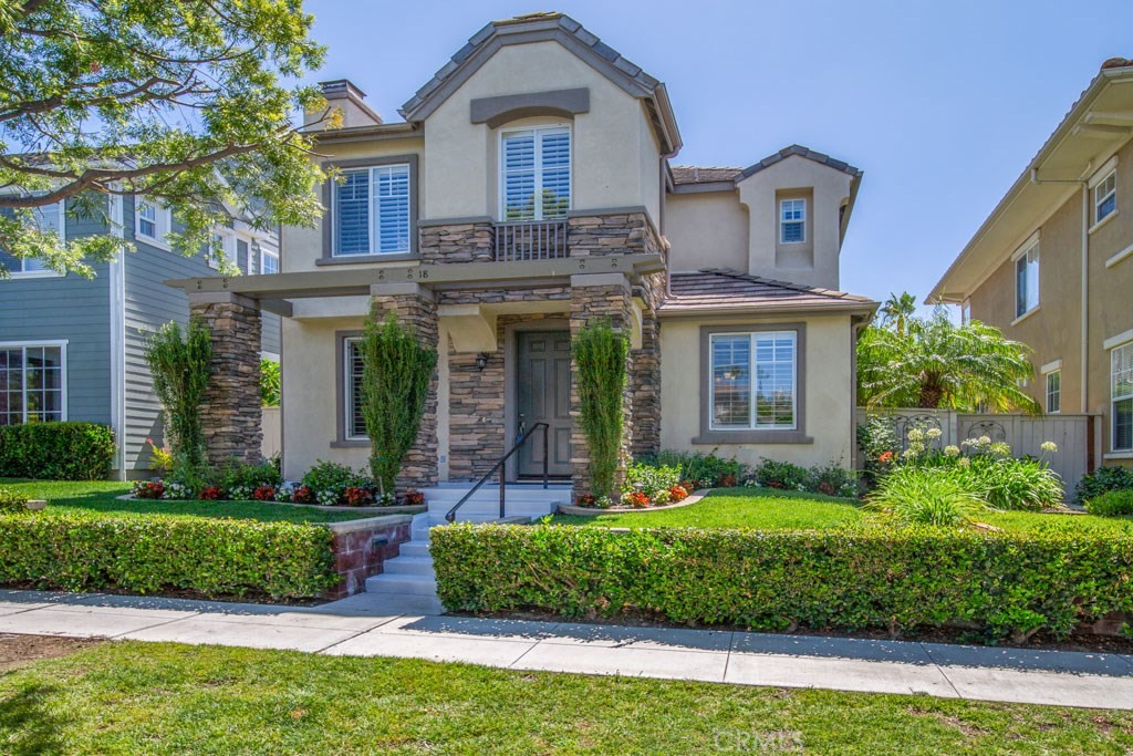 18 Clematis Street Ladera Ranch, CA 92694 - Photo 1 of 1 a front view of a house with a yard and garage