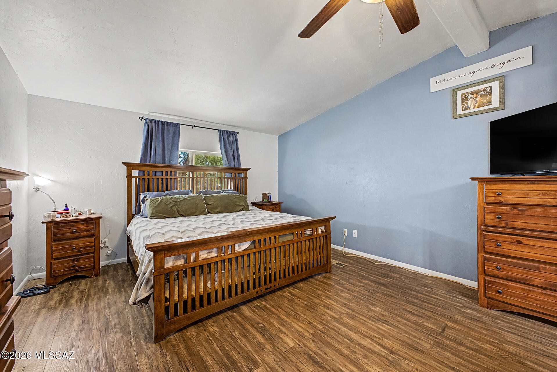 4231 East Pinal Street Tucson, AZ 85739 - Photo 23 of 36 a bedroom with furniture and wooden floor