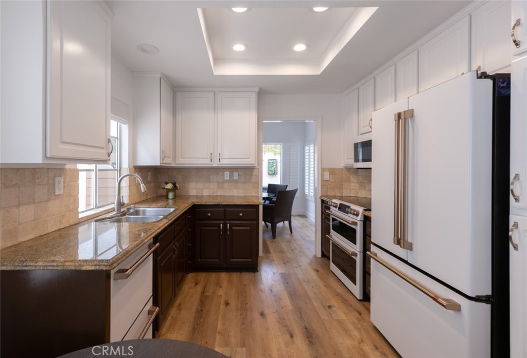 20 St Michael Dana Point, CA 92629 - Photo 11 of 43 a kitchen with granite countertop a refrigerator stove and oven