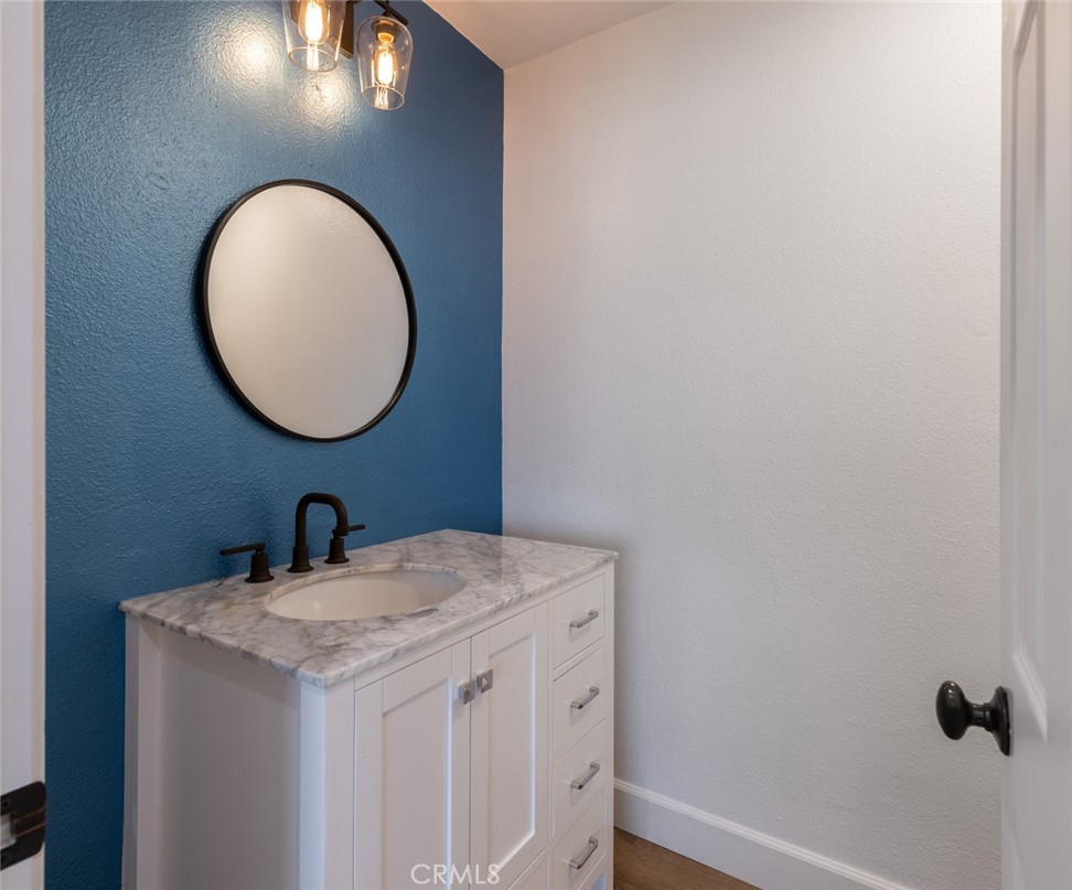 20 St Michael Dana Point, CA 92629 - Photo 14 of 43 a bathroom with a sink and a mirror