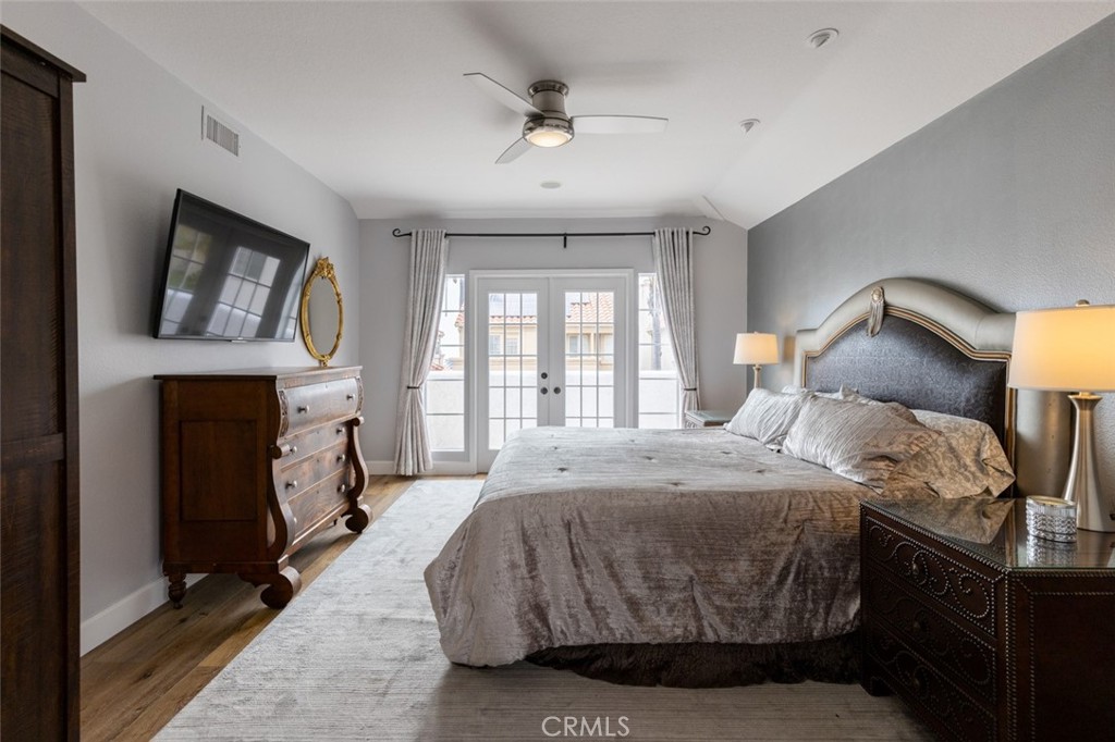 20 St Michael Dana Point, CA 92629 - Photo 15 of 43 a spacious bedroom with a bed and a fireplace