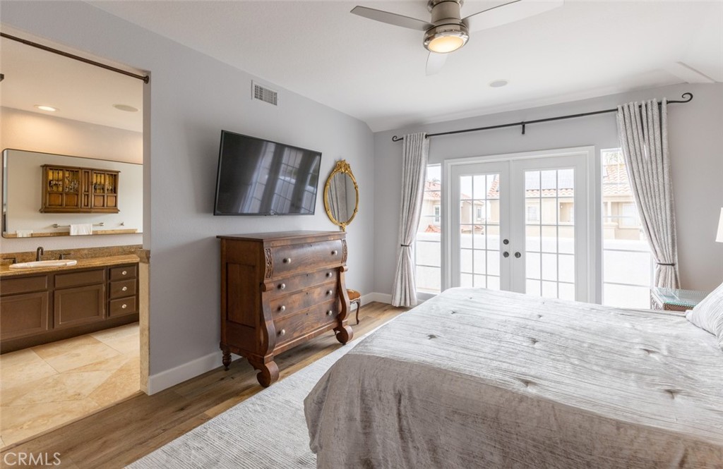 20 St Michael Dana Point, CA 92629 - Photo 16 of 43 a bedroom with a bed and a flat screen tv