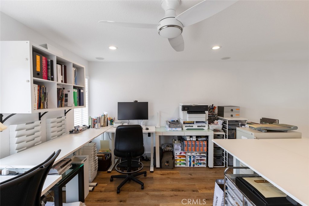 20 St Michael Dana Point, CA 92629 - Photo 23 of 43 a view of a workspace with furniture and a bookshelf