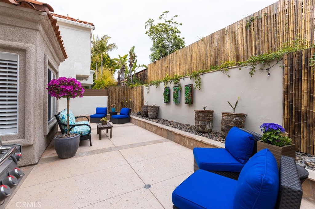 20 St Michael Dana Point, CA 92629 - Photo 28 of 43 a view of a chairs and table in the backyard