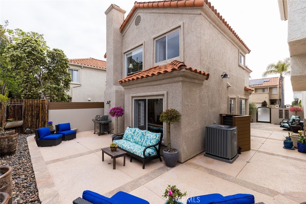 20 St Michael Dana Point, CA 92629 - Photo 29 of 43 a view of a patio with couches chairs and a fire pit