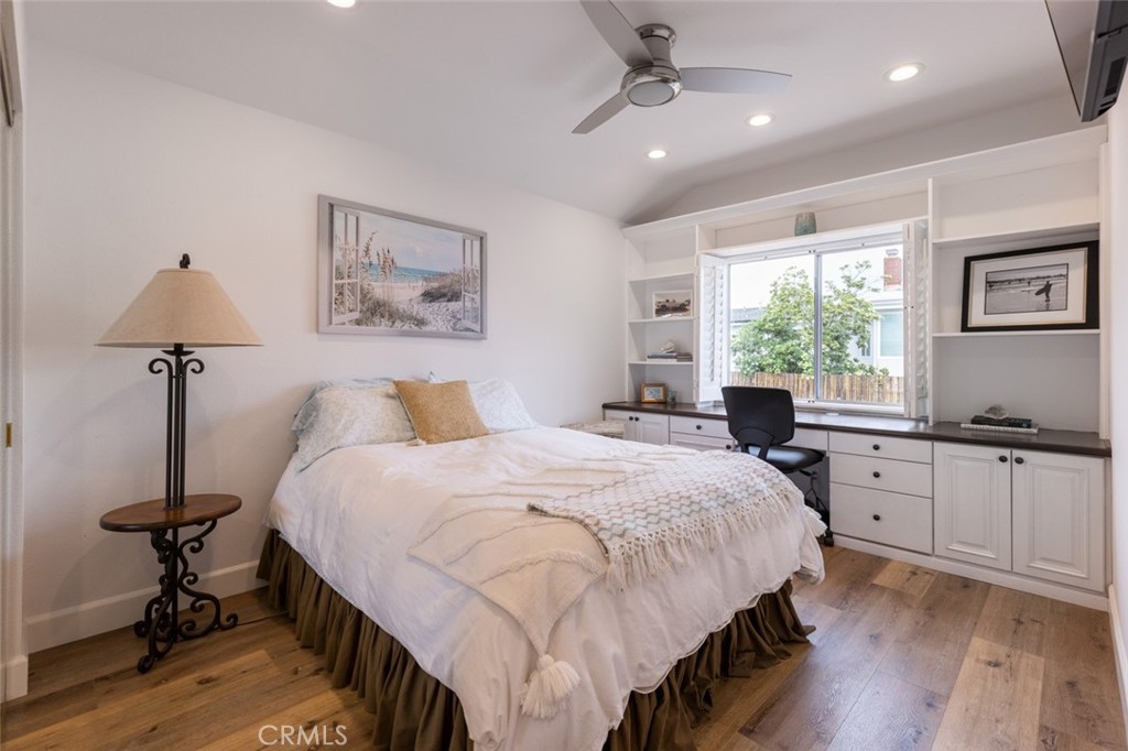 20 St Michael Dana Point, CA 92629 - Photo 33 of 43 a bedroom with a large bed and a chandelier