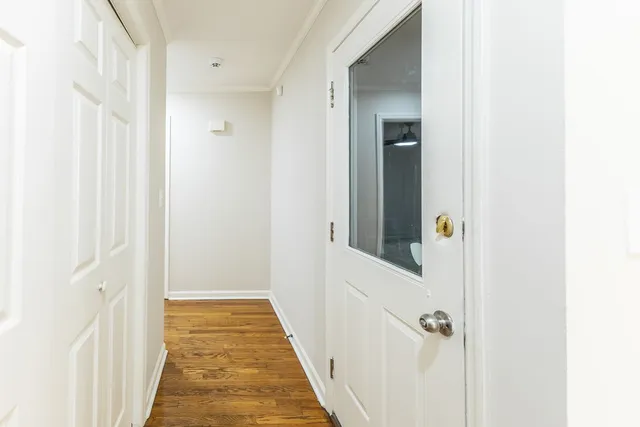 a view of a bathroom from a hallway
