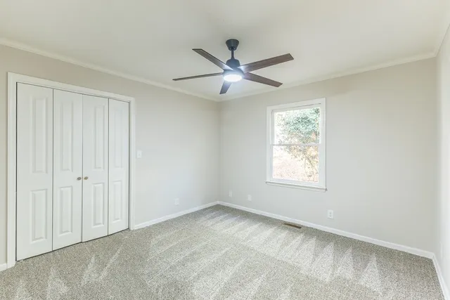 a view of an empty room with a window