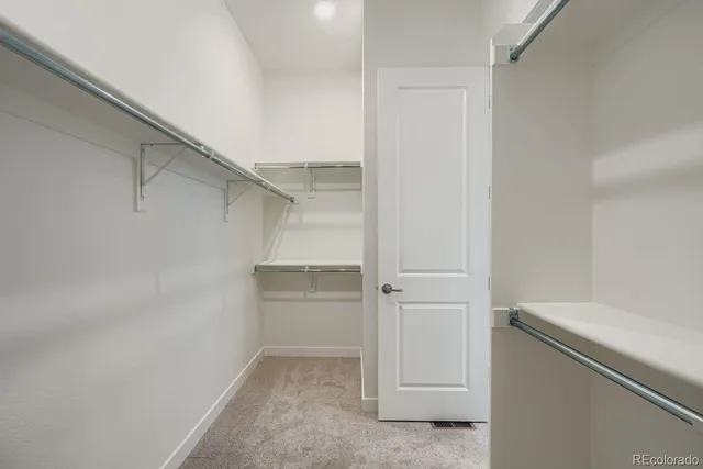 a view of an empty walk in closet