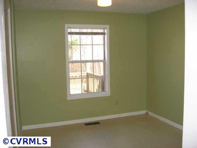 645 Barnaby Road Palmyra, VA 22963 - Photo 5 of 10 an empty room with a window