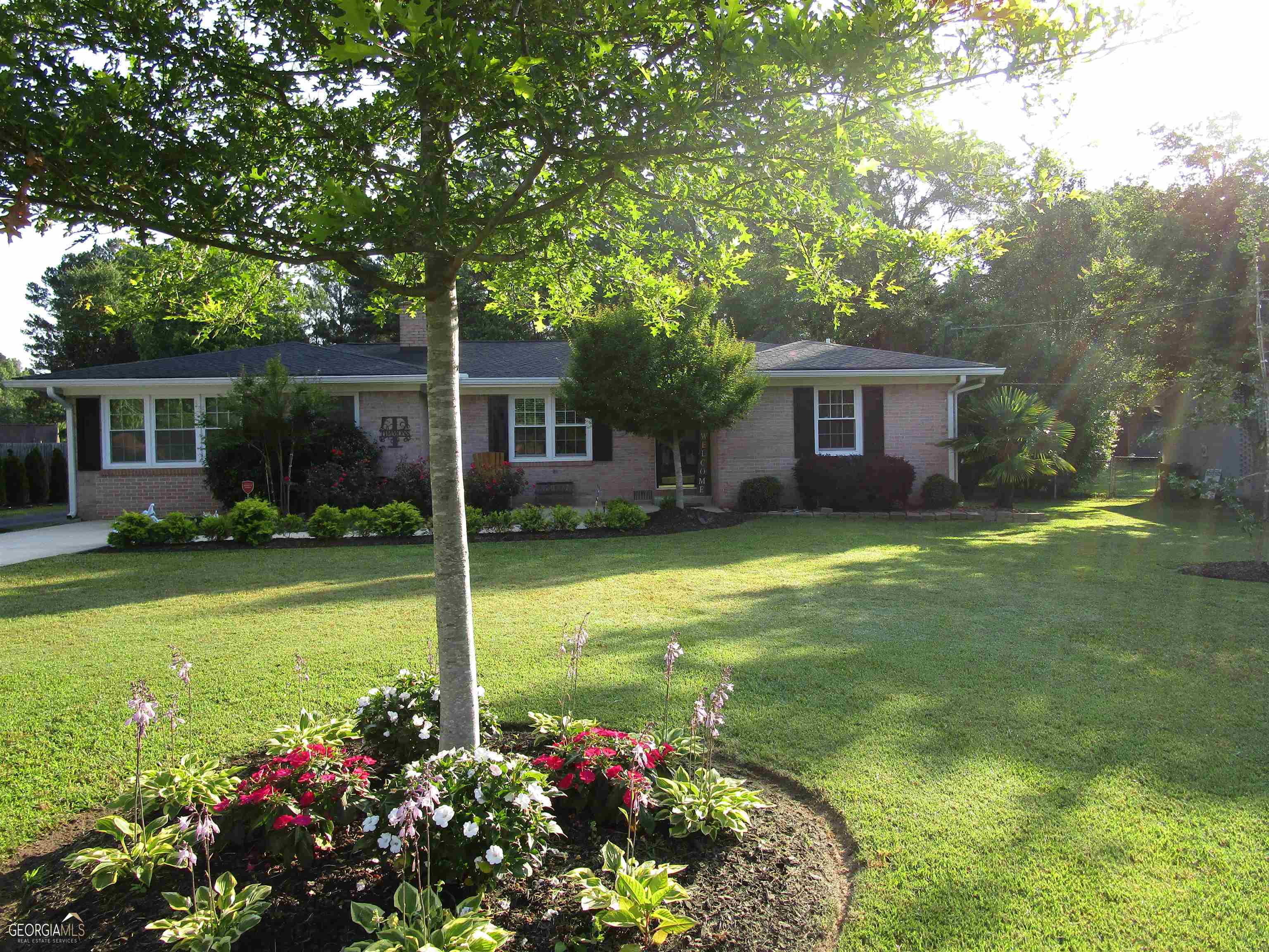 119 Maddox Road Griffin, GA 30224 - Photo 1 of 1 a view of a house with a backyard
