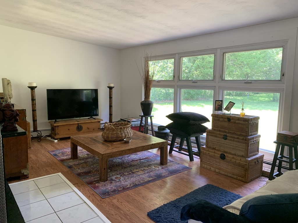 60 Gregory Road Framingham, MA 01701 - Photo 7 of 14 a living room with furniture and a flat screen tv