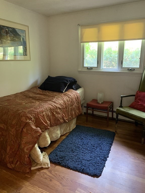 60 Gregory Road Framingham, MA 01701 - Photo 10 of 14 a bedroom with a bed wooden floor and window