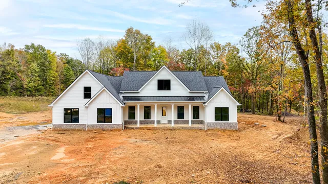 a house with trees in the background