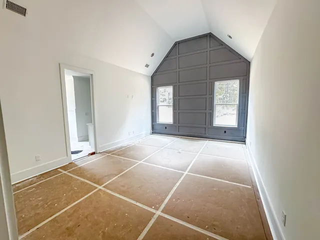 a view of a kitchen with white cabinets