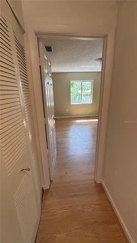 an entryway with stairs and a window