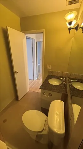 a bathroom with a sink and mirror