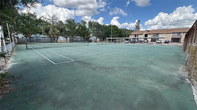 a view of a playground with basketball court