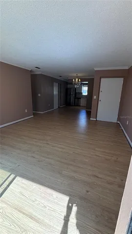 a view of a livingroom with wooden floor