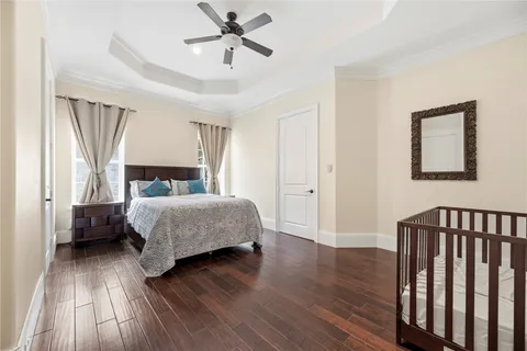 a bedroom with a large bed and a large window